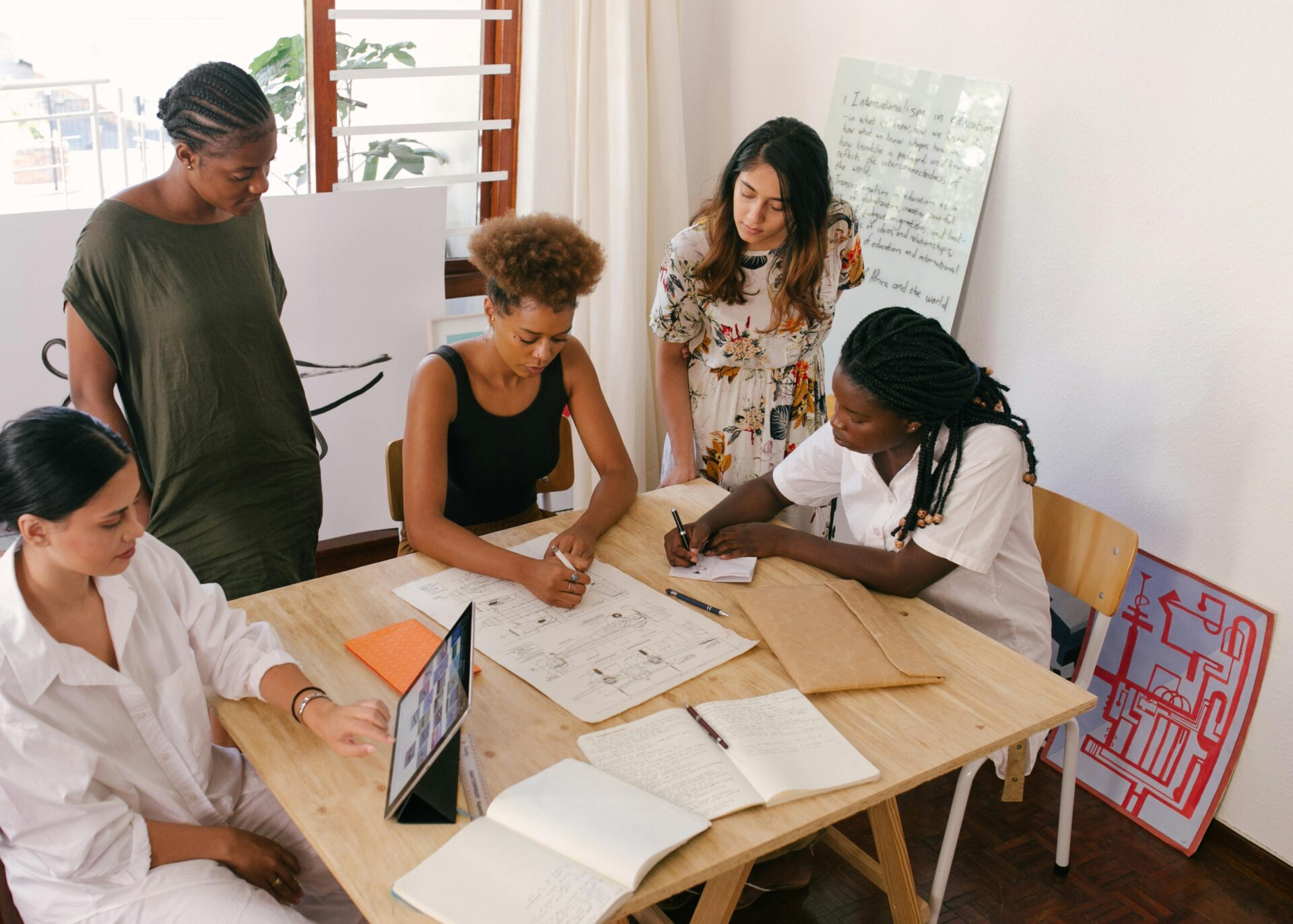 A group of people working on a white paper